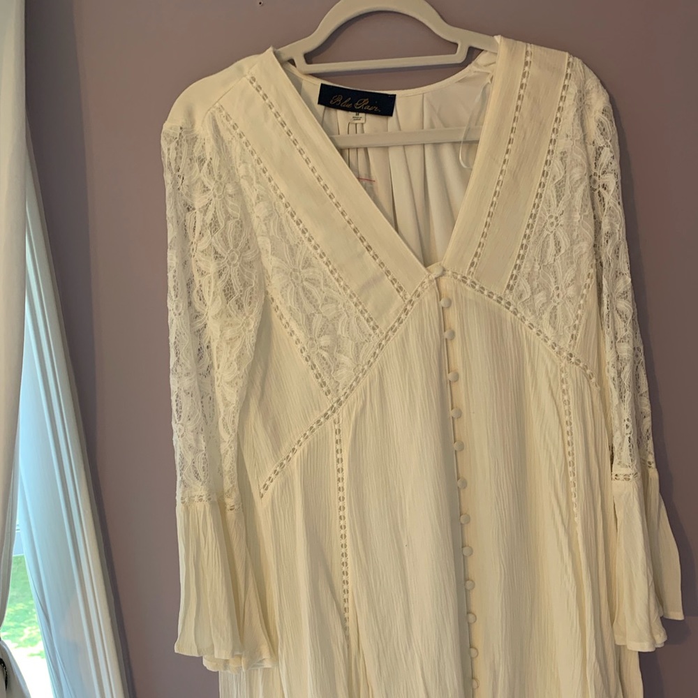 white lace dress with v-cut.